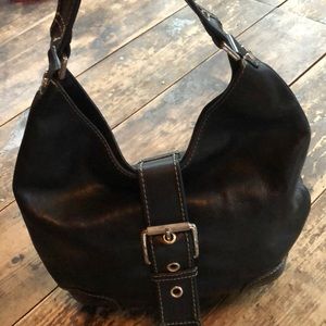 Black leather handbag by Michael Kors